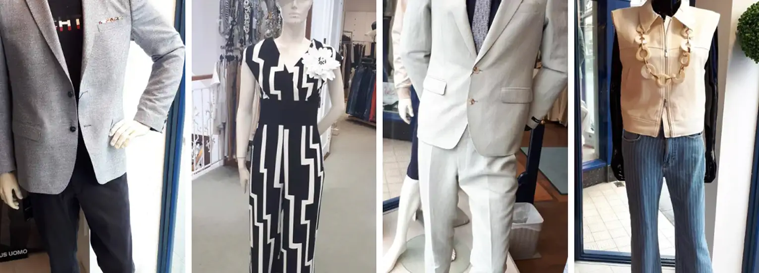 Four mannequins display different outfits: a grey blazer with black trousers, a black and white patterned dress, a light grey suit with a tie, and a sleeveless beige top with blue jeans and a chunky necklace.