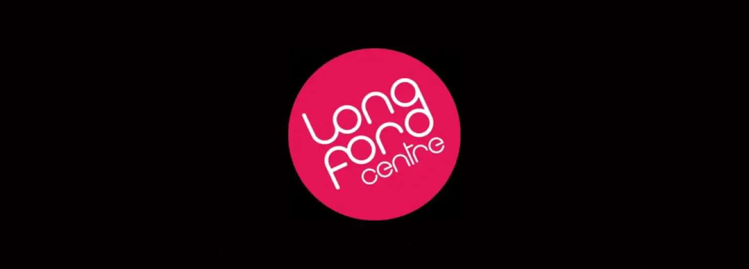 A pink oval logo with the words "Longford Centre" written in stylised white text on a black background.