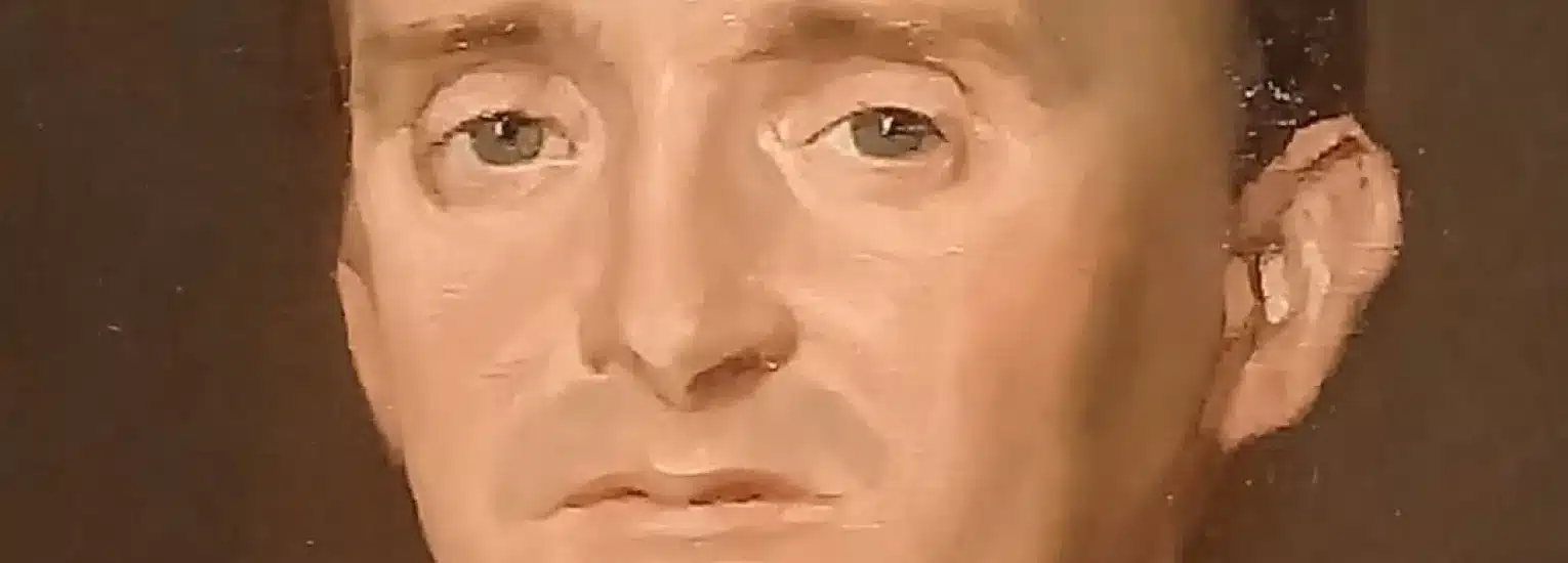 A close-up of a painted portrait showing a person with short dark hair, light skin, and blue eyes, looking directly forward with a neutral expression. The background is dark and plain.