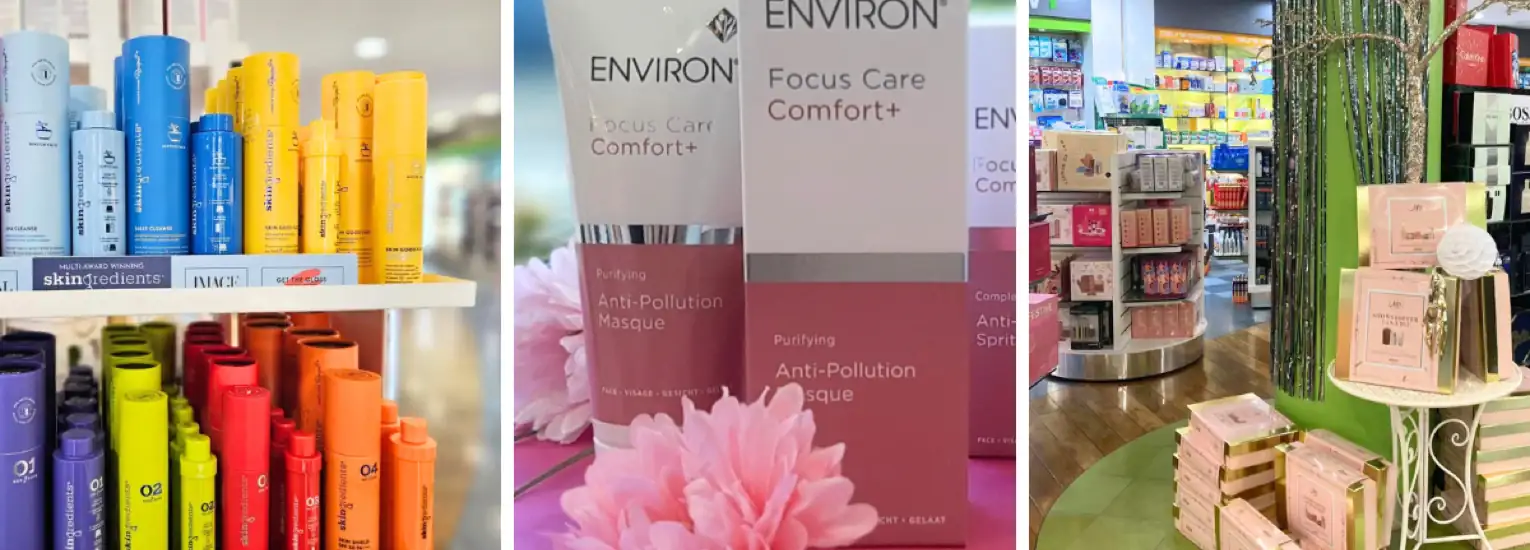Shelves displaying colourful skincare and beauty products, including bottles and boxes in various shades, with some pink flowers as decoration and a lush, inviting shop atmosphere.