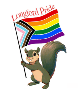 A smiling cartoon squirrel holds a Progress Pride flag with the words “Longford Pride” above it. The flag features rainbow stripes along with black, brown, light blue, pink, and white chevrons.